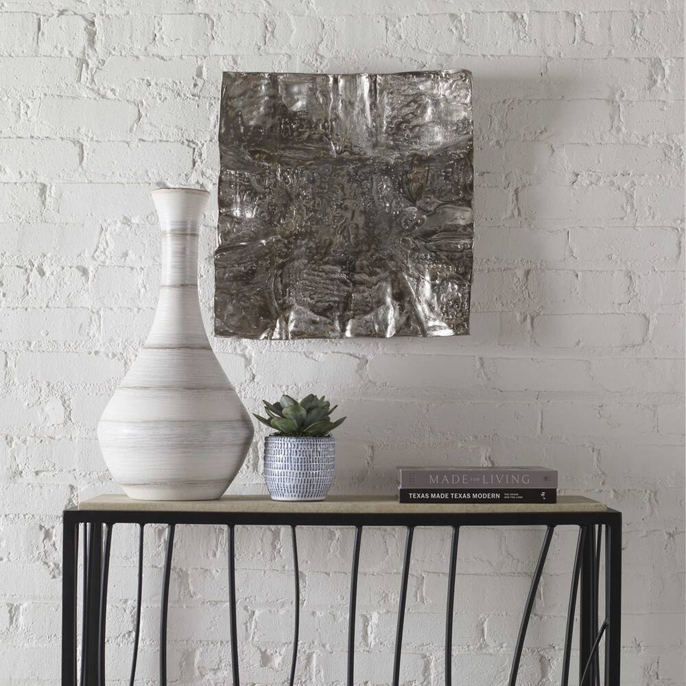 Handcrafted nickel wall art with a vintage-inspired design, perfect for adding elegance to any space.