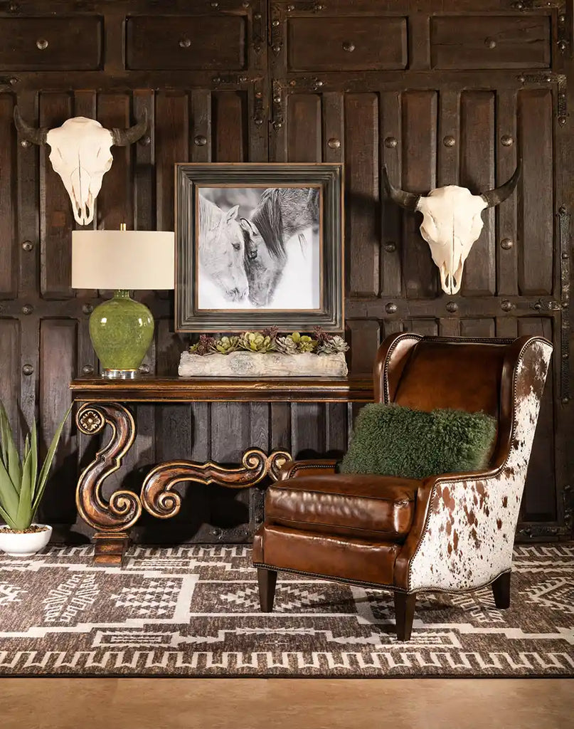 The Alanna Leather Chair styled in a rustic room, highlighting its artisanal leather and timeless appeal.