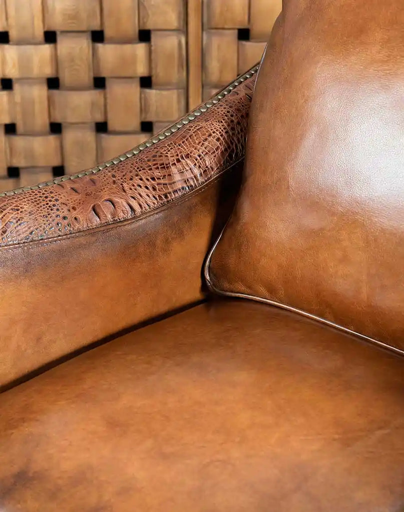 Detailed texture of the large crocodile embossed leather on the Allie Calexico Swivel Glider.