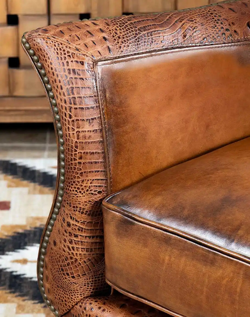 Detailed view of the handcrafted leather armrest on the Allie Calexico Swivel Glider for added elegance and support.