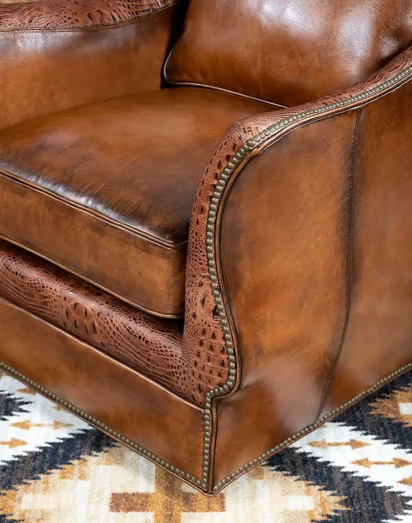 Intricate tack detailing on the Allie Calexico Swivel Glider, showcasing fine craftsmanship and elegant accents.