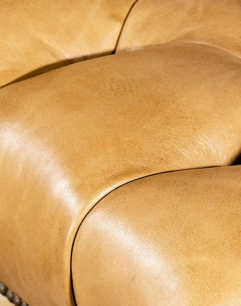 A close-up of the hand-burnished full-grain leather, showcasing its unique variations and smooth finish.