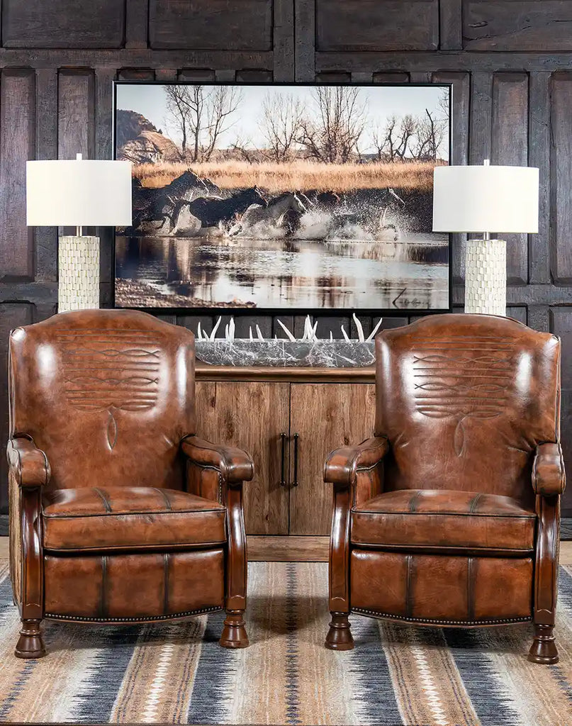 The recliner styled in a rustic living room with warm lighting and wooden furniture.
