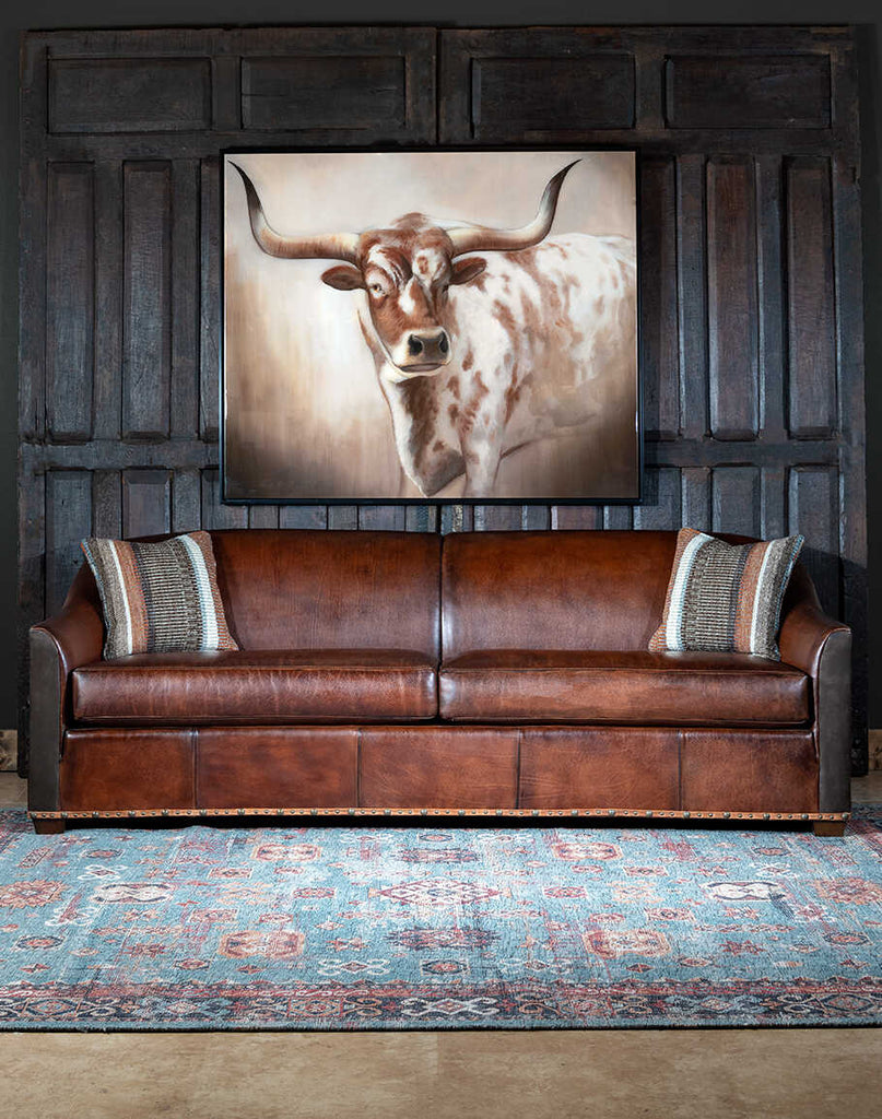 Front view of the Argo Leather Sofa showcasing its full-grain and Nubuck leather upholstery, brass nail tacks, and traditional craftsmanship details.