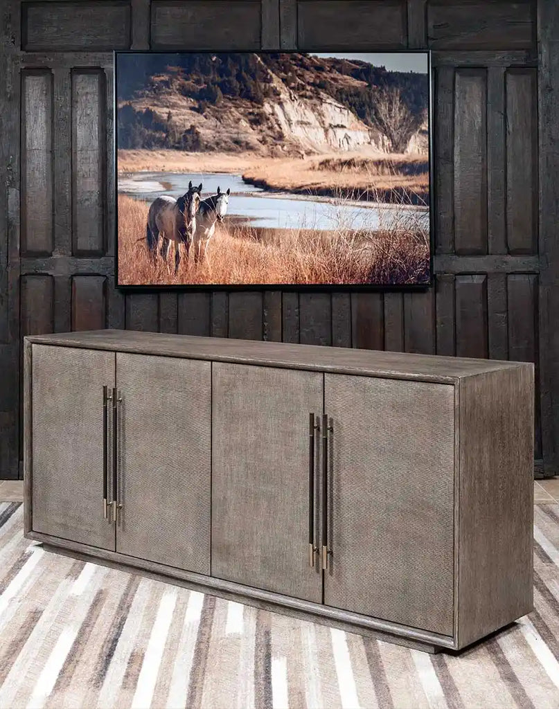 A side-angle perspective of the Ashton Media Console, highlighting its sleek modern-rustic design and wire-brushed oak veneer texture.