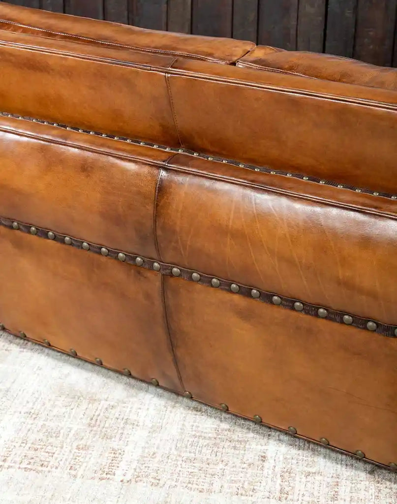 Side angle of the Herdsman Leather Sofa's back, highlighting the seamless leather finish and fine craftsmanship.