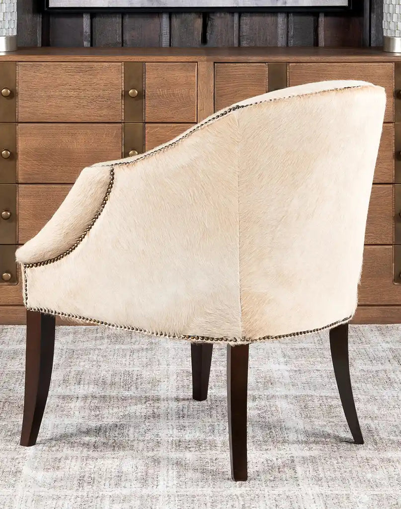 A back view of the Hertfordshire Sand Cowhide Chair, showing the seamless cowhide detailing and clean craftsmanship.