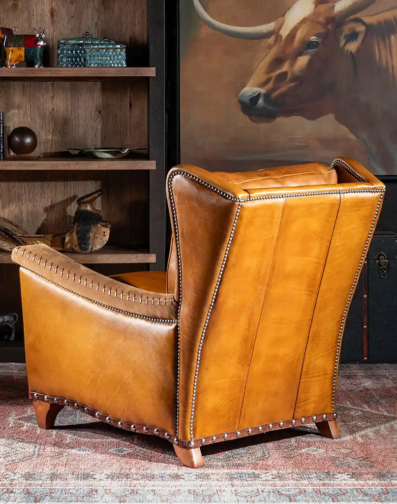 A rear view of the Norseman Leather Chair, showcasing the seamless finish of its leather backrest.