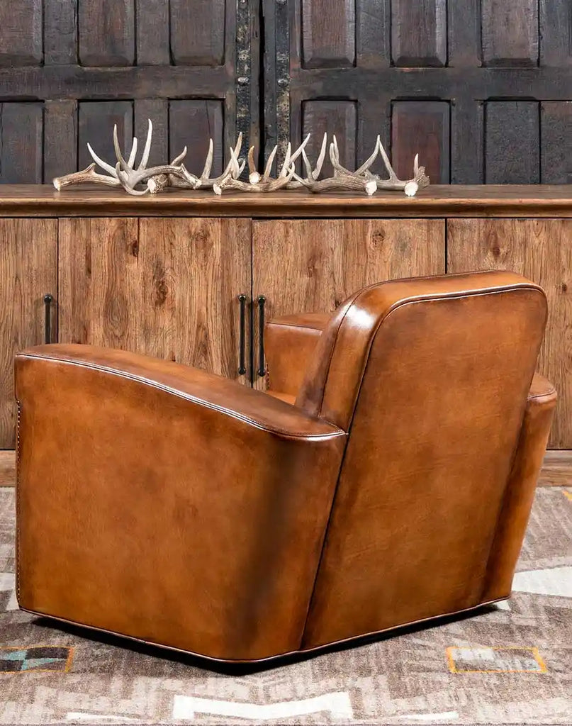 Back view of the Yeager Swivel Chair highlighting the hand-burnished leather finish and seamless craftsmanship.