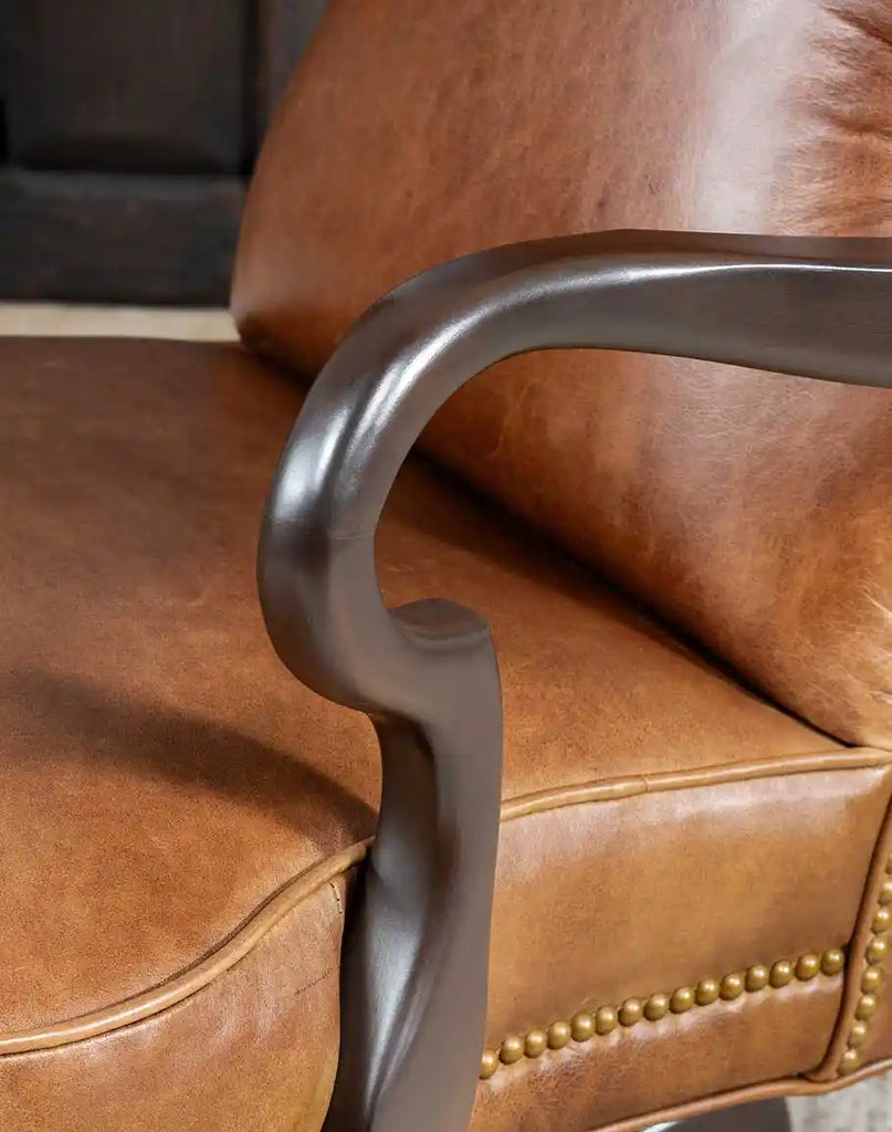 Close-up of the smooth wooden armrests of the Baileys Boot Stitch Office Chair, crafted for ergonomic support.