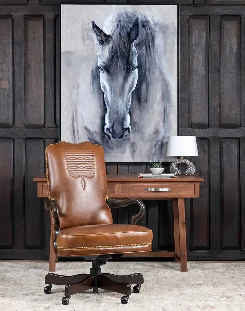 Baileys Boot Stitch Office Chair styled in a rustic ranch-inspired room with wooden paneling and Western decor.