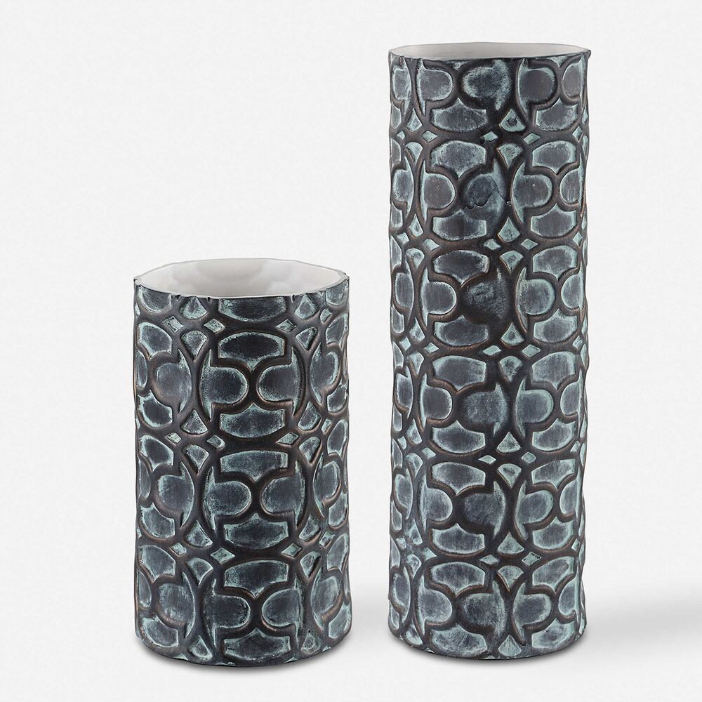 Baltra ceramic vases in small and large sizes, featuring a verdigris glaze and water-tight interiors for displaying fresh flowers.