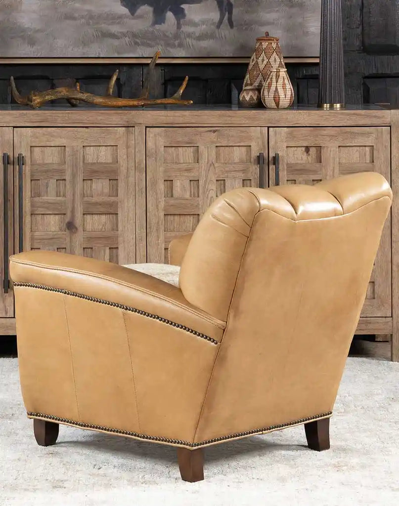 Back view of the Beige Sand Club Chair featuring smooth leather detailing and a clean, minimalistic design.