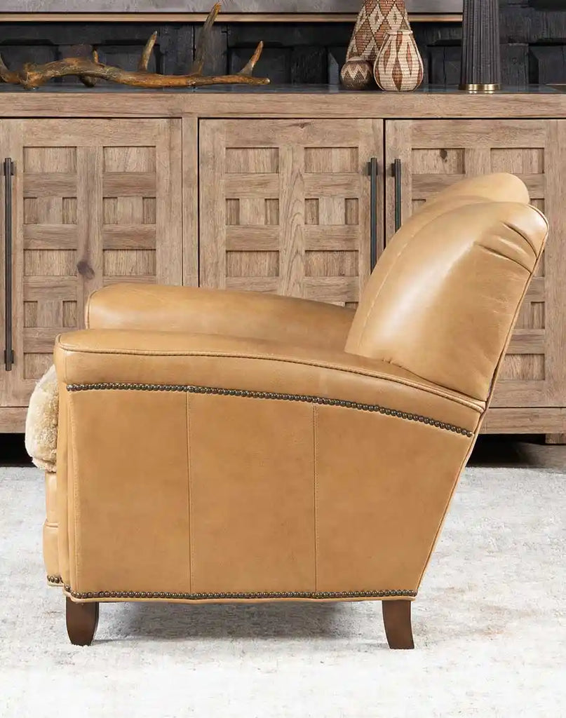 Side view of the Beige Sand Club Chair highlighting the hand-burnished leather and sleek arm design with premium craftsmanship.