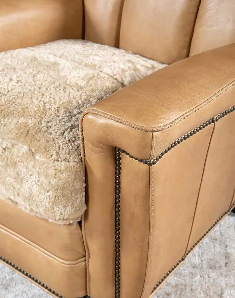 A top view of the Beige Sand Club Chair seat cushion made of upholstery-grade cream shearling hide for added luxury and comfort.