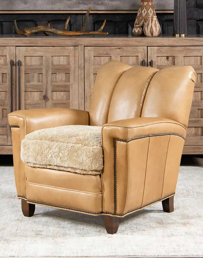 Beige Sand Club Chair showcasing its low-profile design, palomino full-grain leather upholstery, and channeled backrest for optimal comfort.