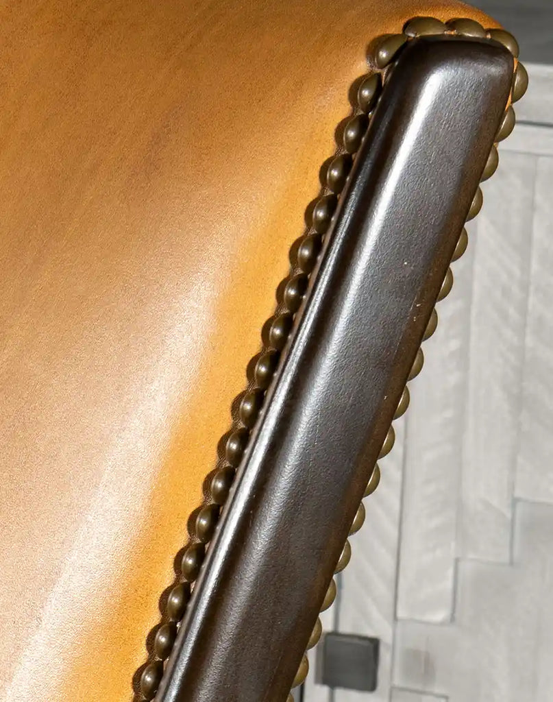 A close-up of the hand-antiqued leather on the Boleyn Leather Chair, emphasizing its unique texture and sophisticated finish.