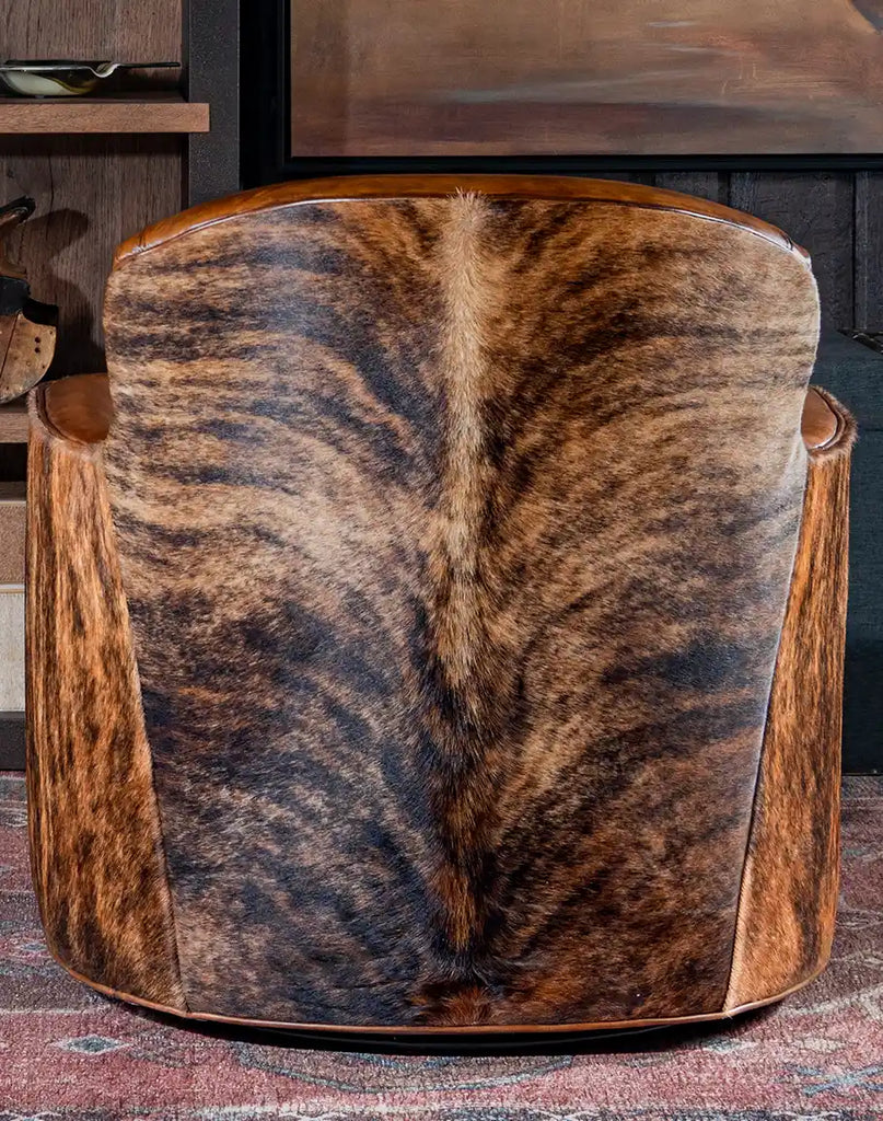 Rear view of the Bourbon Barrel Swivel Chair showcasing the upholstery-grade brindle cowhide material.