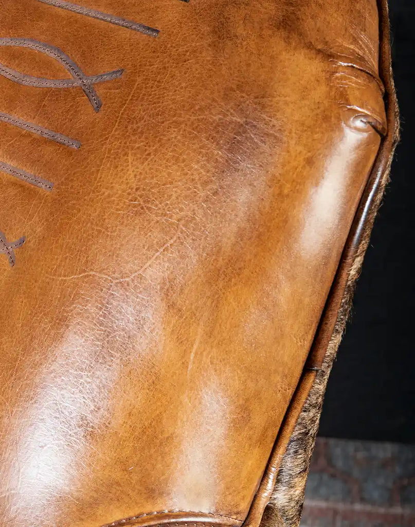 Close-up of the hand-burnished details and precision craftsmanship of the Bourbon Barrel Swivel Chair.