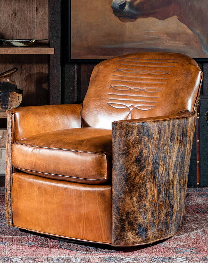 Bourbon Barrel Swivel Chair showcasing its cowboy boot stitched emblem and luxurious leather upholstery.