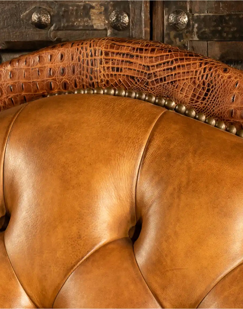 Close-up of the tufted leather back on the Brandon Tufted Leather Sofa, highlighting its intricate craftsmanship.