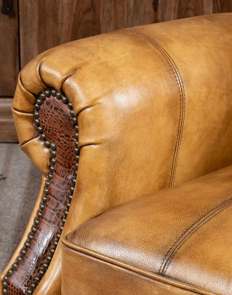 Close-up of the armrest on the Bravo Westworth Recliner, featuring croc-embossed leather and precision stitching.