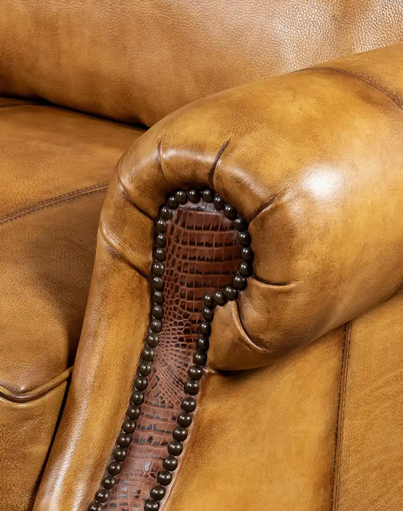 A close-up view of the brass nailhead trim on the Bravo Westworth Recliner, accentuating its rustic elegance and craftsmanship.