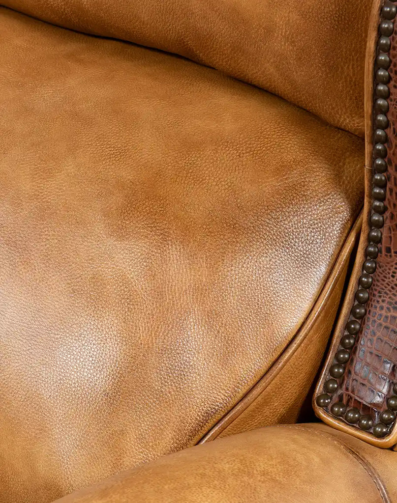 Detailed shot of the hand-burnished full-grain leather on the Bravo Westworth Recliner, highlighting its natural variations and luxurious finish.