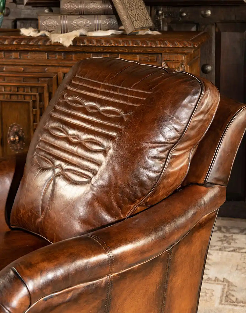 Detailed view of the cowboy boot stitch inlaid into the leather of the Brono Swivel Glider Chair.