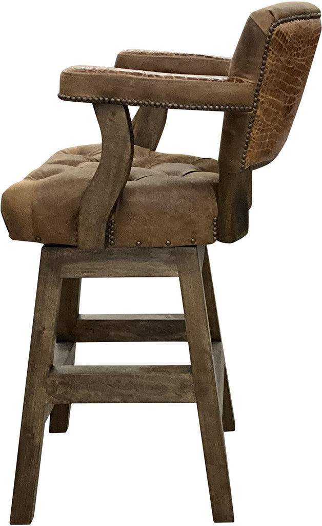 Side profile of the Brown Apachean Barstool, highlighting the rustic cognac gator embossed leather on the arm and outside back, complemented by antique brass nail heads.