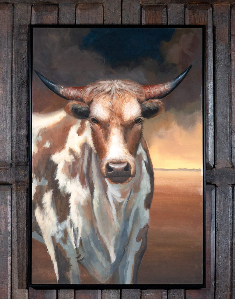 A front view of the Bull of Valor Portrait framed art, featuring a powerful bull in a captivating portrait with a sleek black frame, symbolizing strength and resilience.