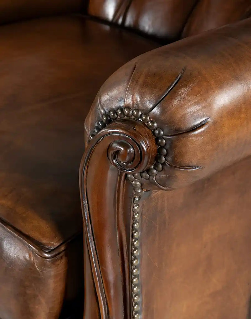 Detailed view of the Cameron Leather Recliner's studding, adding a touch of elegance to its design.