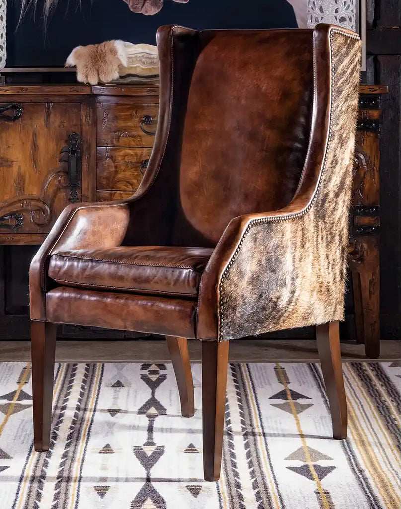 The Cantina Leather Chair in full-grain leather with a hand-tanned finish, featuring a rustic Western-inspired design.