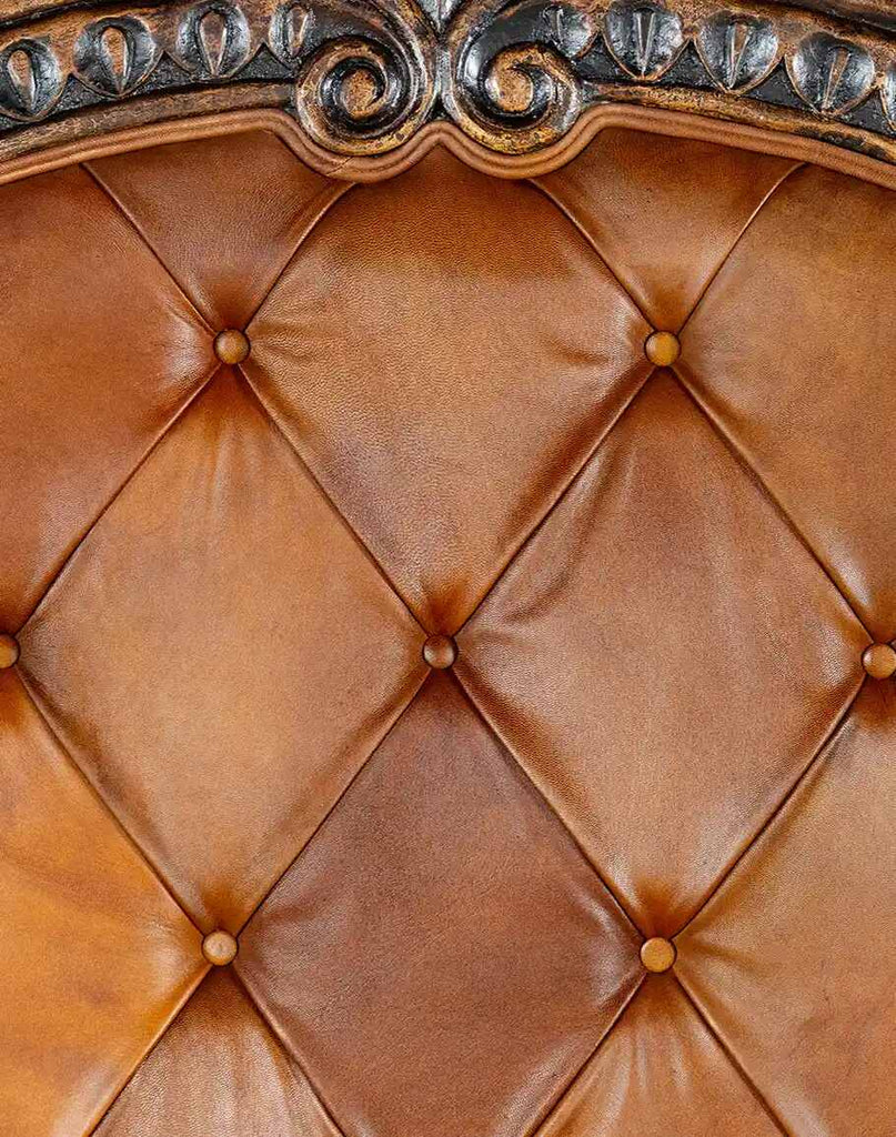 Close-up of the button-tufted headboard on the Carolina Bed, emphasizing its sophisticated design.