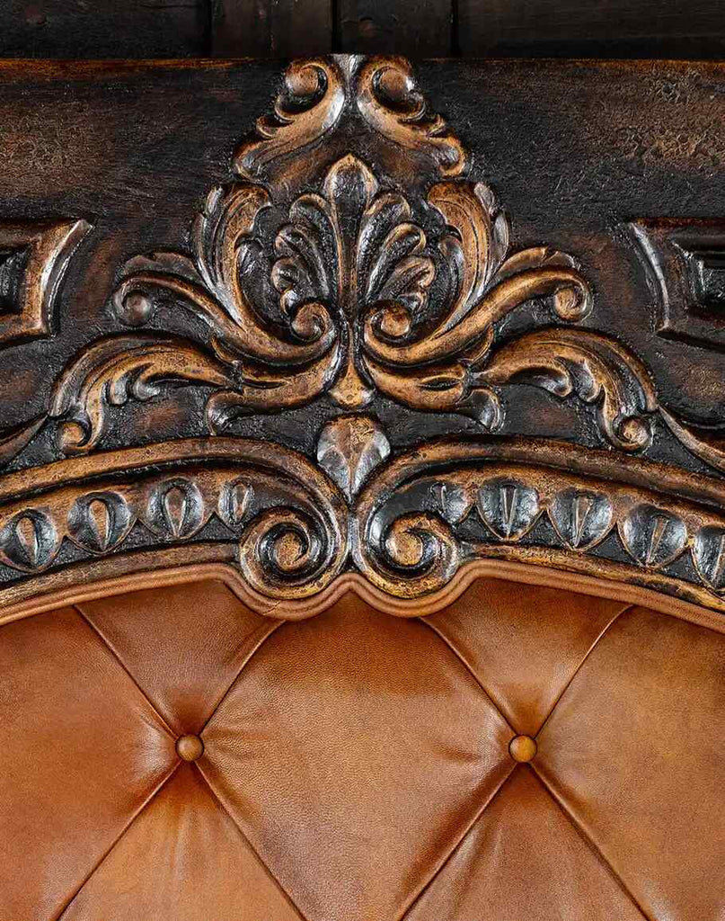 Detailed view of the elegant carvings on the Carolina Bed, reflecting old-world Spanish charm.