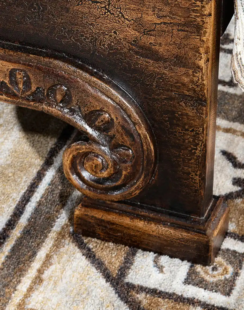 Image focusing on the intricately designed support legs of the Carolina Bed, reminiscent of Gothic architecture.