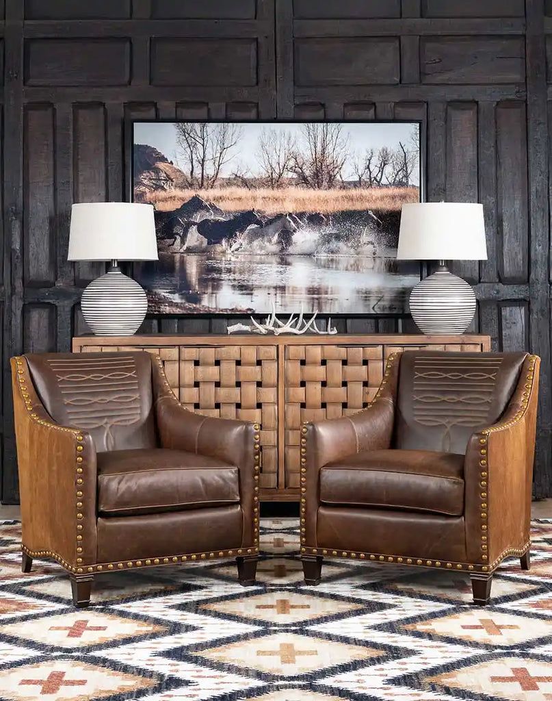 Front view of the Cassie Brown Leather Chair, showcasing its chocolate full-grain leather upholstery and brass nailhead trim.