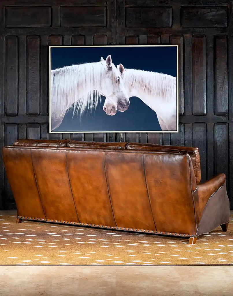 A rear view of the sofa, showcasing the seamless leatherwork and sturdy frame construction.