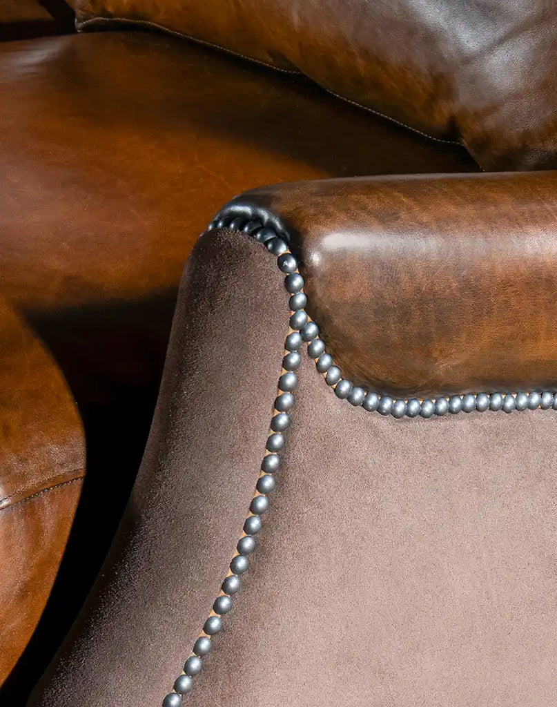 Close-up of the brushed sueded leather armrests, adding a rustic yet refined touch to the sofa's design.