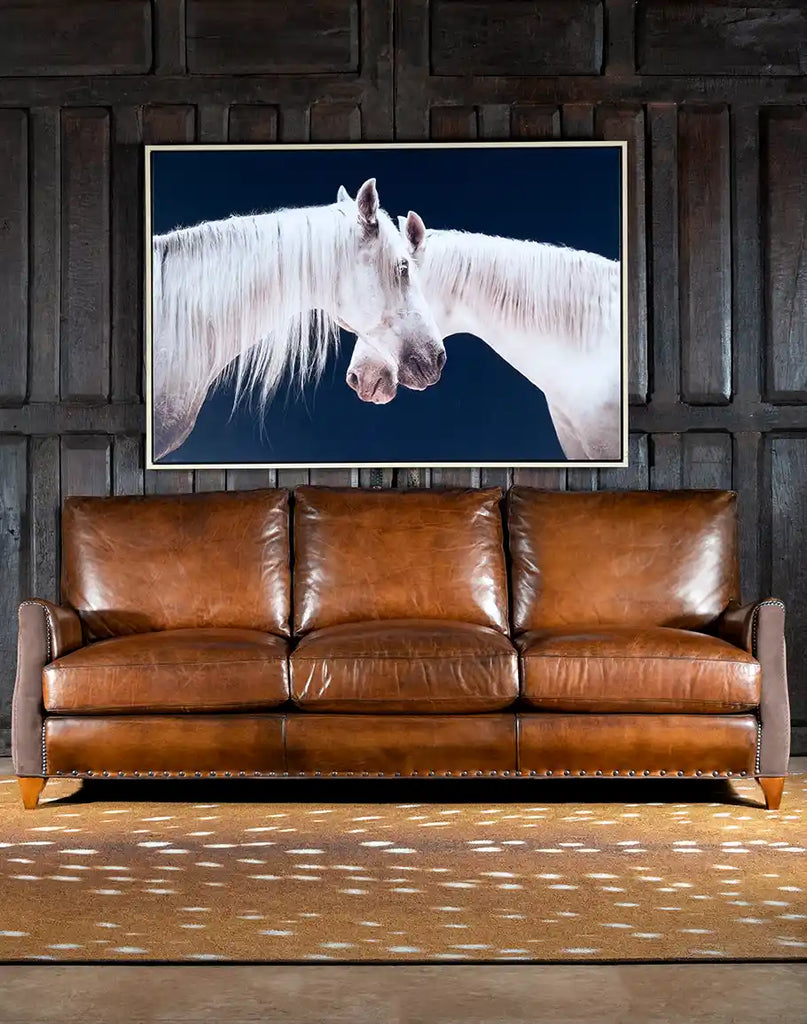 Full front view of the Cayote Leather Sofa, showcasing its handcrafted full-grain leather and brushed sueded leather arm accents.