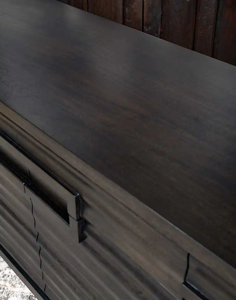 Close-up of the espresso wood finish on the top surface of the Charcoal Cascade Buffet, showcasing its rich color and natural texture.