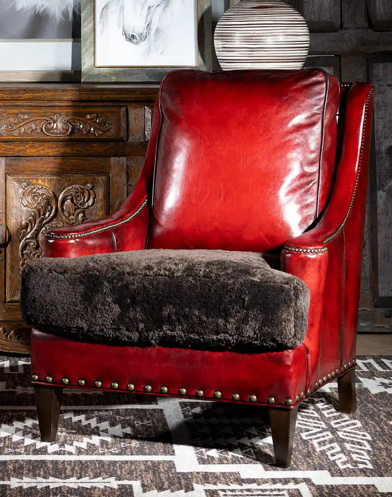 Angled view of the Cherry Red Leather Chair highlighting its mountain modern design and premium distressed leather.