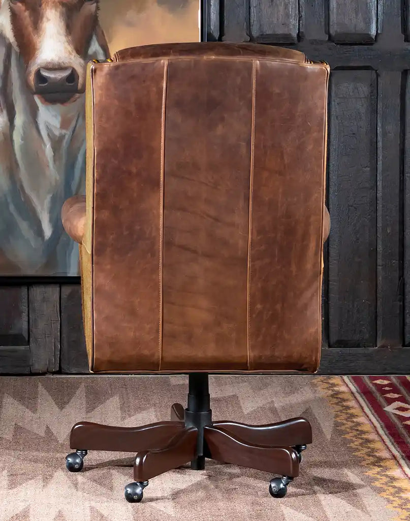 Rear view of the Chestnut Brown True Grit Executive Desk Chair displaying the bustle back design and brass nail tacks with gold finish.