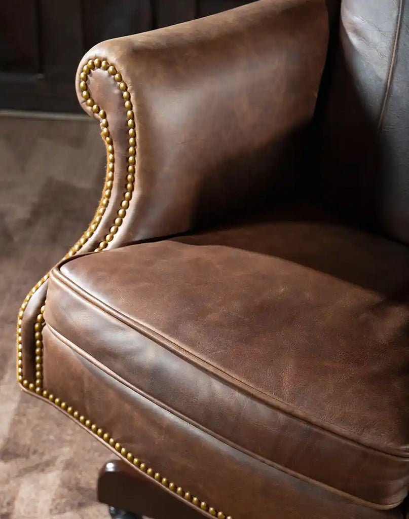 View of the plush seat cushion of the Chestnut Brown True Grit Executive Desk Chair upholstered in full-grain brown leather for superior comfort.