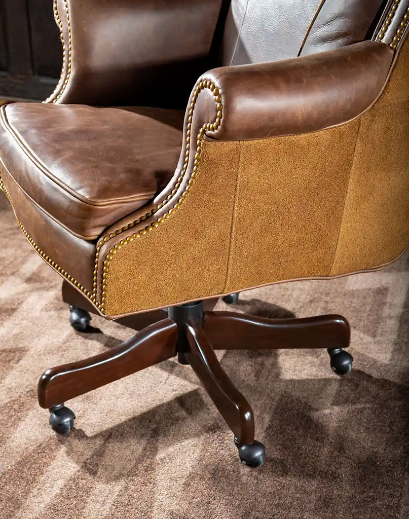 Image of the sturdy swivel base of the Chestnut Brown True Grit Executive Desk Chair providing mobility and support.