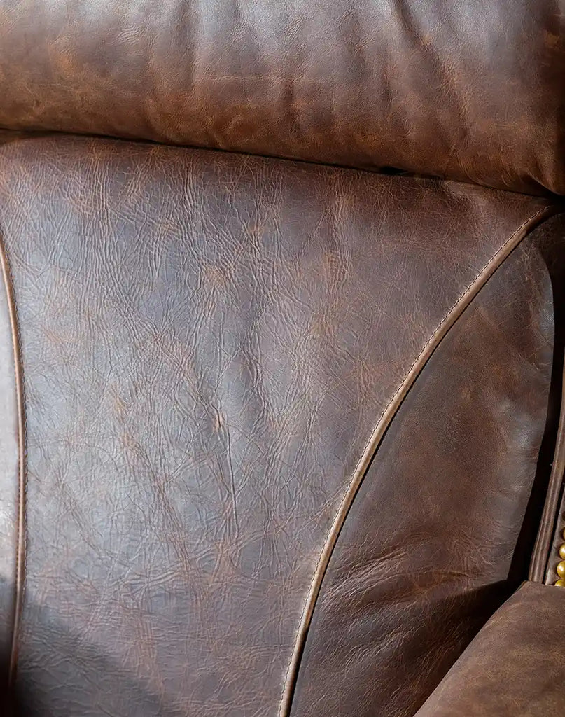 Close-up of the meticulous stitching on the full-grain brown leather upholstery of the Chestnut Brown True Grit Executive Desk Chair.