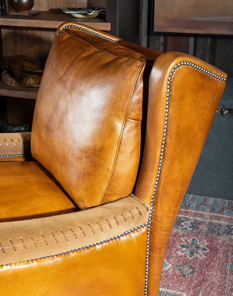 Detailed close-up of the premium full-grain leather upholstery on the Norseman Leather Chair, emphasizing its quality and texture.