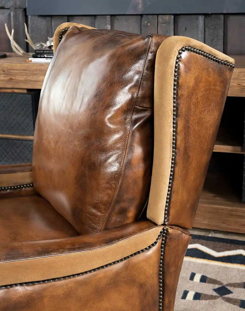 Close-up of the full-grain leather on the Vlad Recliner, showing its rich mocha tone and smooth texture.