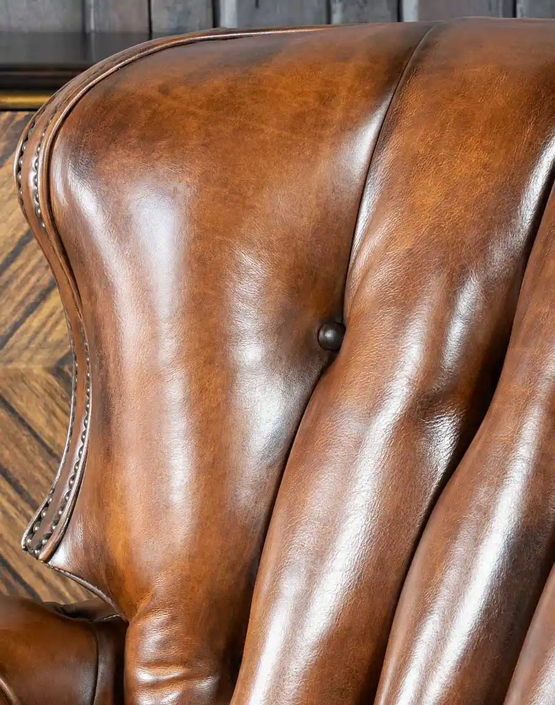 Zoomed-in view of the subtle stitching details on the Byron Leather Recliner, reflecting expert craftsmanship.