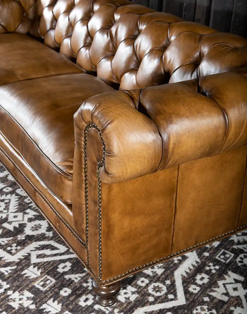 Detailed view of the deep diamond tufting on the Nova Chesterfield Sofa's backrest.